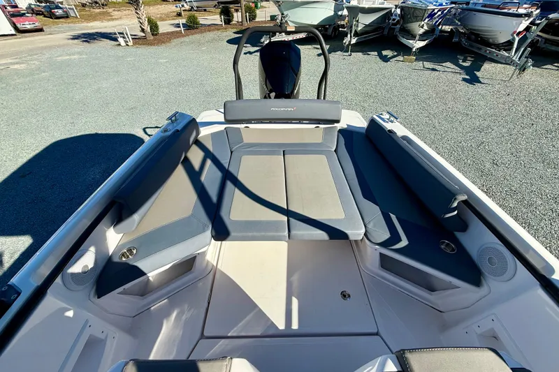 Slide: The Image of 2022 Axopar 22 boat interior with cushioned seating and modern design. - 20