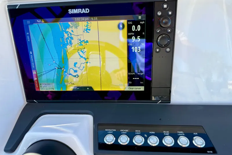 Slide: The Image of Simrad navigation display on 2022 Axopar 22 boat, showing map and controls. - 23
