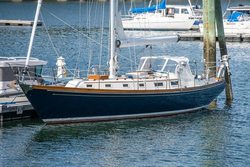 The Image of Sailboat Hank Hinckley OC42, 1984 model, docked in a marina. - 0