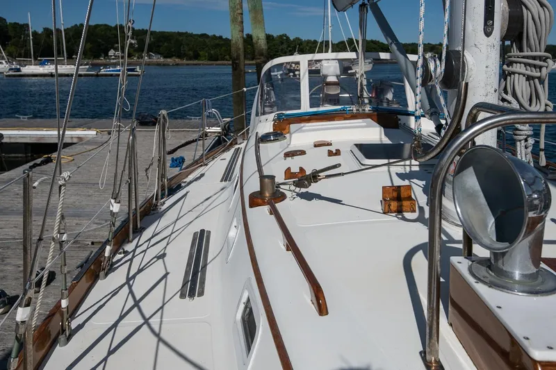 Slide: The Image of 1984 Hank Hinckley OC42 sailboat docked, showcasing deck and rigging details. - 18