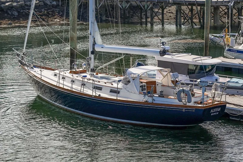 Slide: The Image of Sailboat Hank Hinckley OC42, 1984 model, docked in a marina. - 2