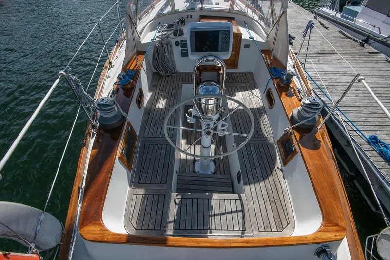 Slide: The Image of Cockpit of 1984 Hank Hinckley OC42 sailboat with wooden deck and steering wheel. - 20