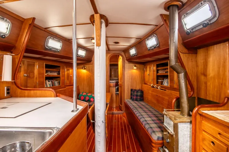 Slide: The Image of Interior of 1984 Hank Hinckley OC42 sailboat with wood finish and cozy seating. - 25