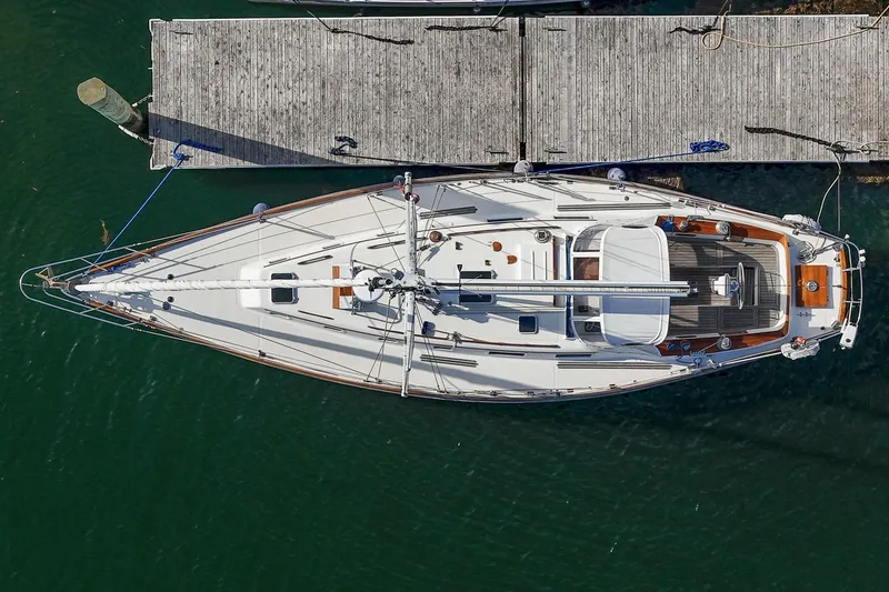 Slide: The Image of Aerial view of 1984 Hank Hinckley OC42 sailboat docked at a wooden pier. - 5