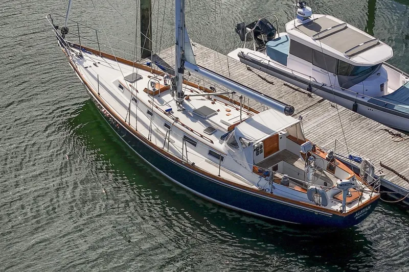 Slide: The Image of Sailboat docked at marina, Hank Hinckley OC42, 1984 model, aerial view. - 6