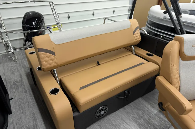 Slide: The Image of 2026 Crest Conquest 235 SLSC boat interior with tan seating and cup holders. - 10