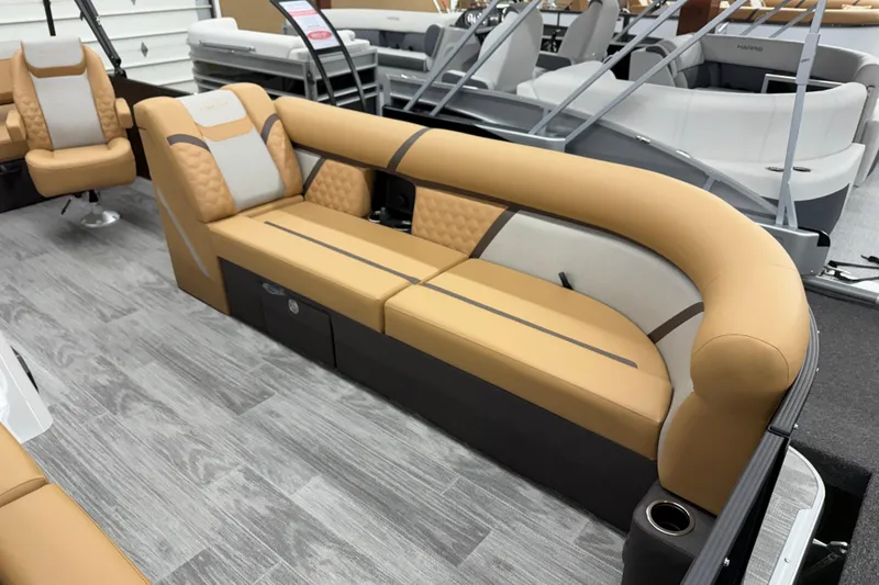 Slide: The Image of 2026 Crest Conquest 235 SLSC boat interior with tan and gray seating. - 3