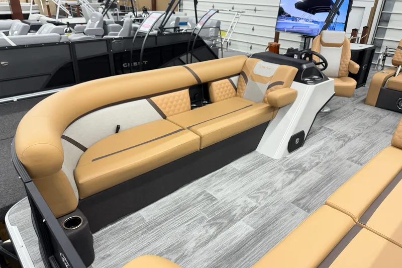 Slide: The Image of Luxurious interior of 2026 Crest Conquest 235 SLSC pontoon boat with tan seating. - 4
