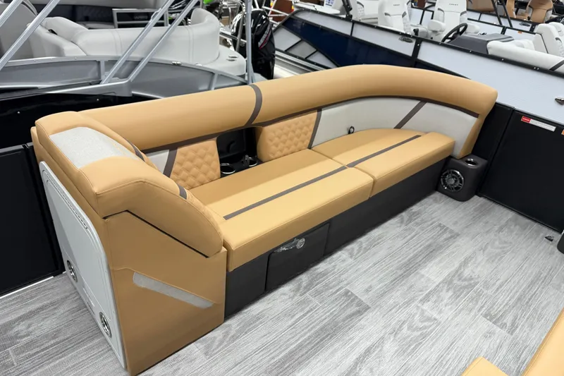Slide: The Image of Luxurious seating on 2026 Crest Conquest 235 SLSC boat, featuring tan upholstery and modern design. - 8