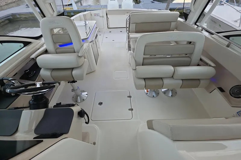 Slide: The Image of 2018 Boston Whaler 320 Vantage interior with plush seating and modern helm. - 14