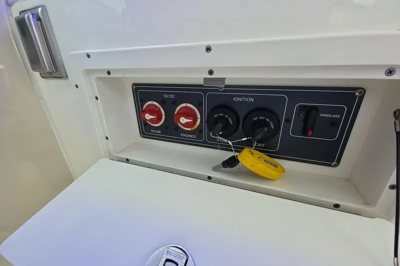 Slide: The Image of Control panel of a 2018 Boston Whaler 320 Vantage boat with ignition switches. - 16