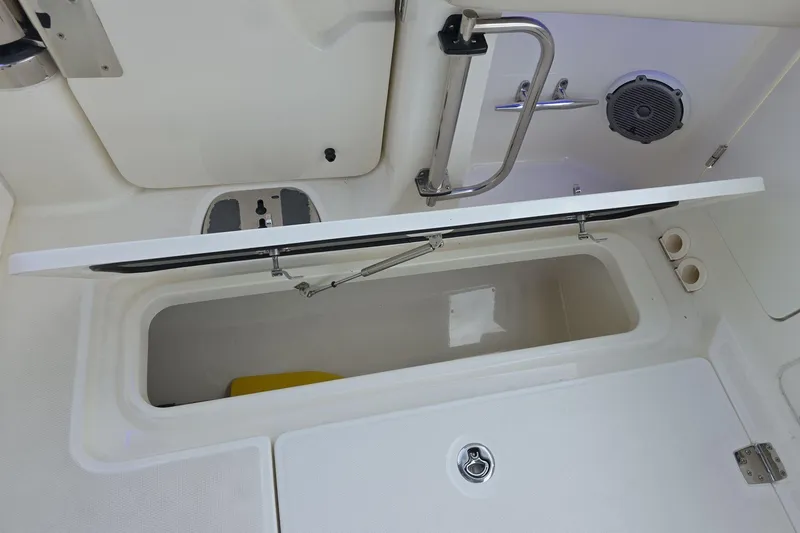 Slide: The Image of Open storage compartment on a 2018 Boston Whaler 320 Vantage boat deck. - 27