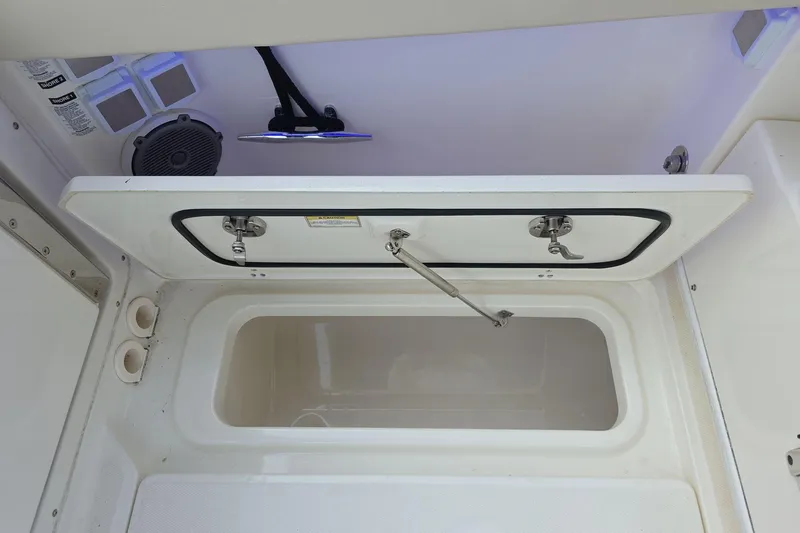 Slide: The Image of Open storage compartment on a 2018 Boston Whaler 320 Vantage boat. - 28