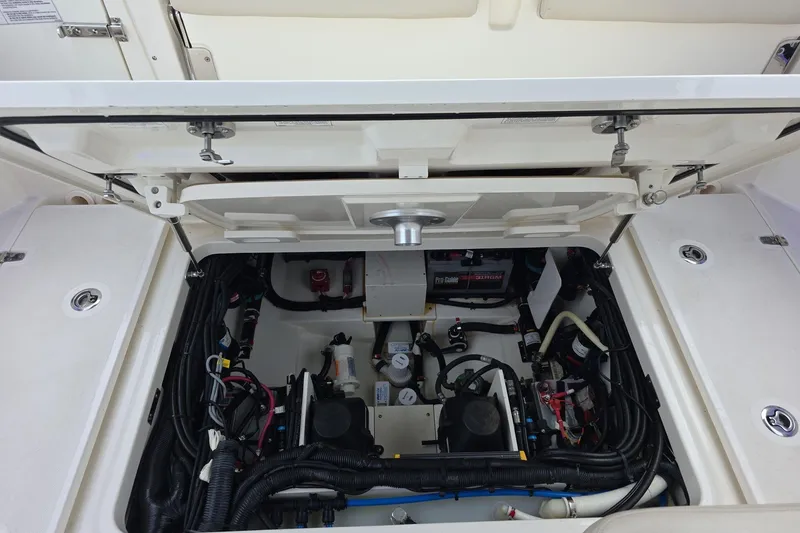 Slide: The Image of 2018 Boston Whaler 320 Vantage engine compartment, showcasing detailed wiring and components. - 29