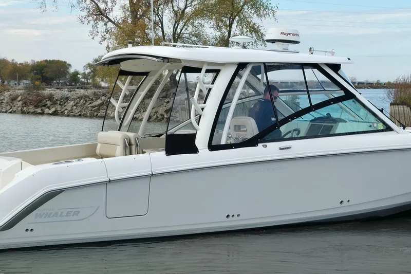 Slide: The Image of 2018 Boston Whaler 320 Vantage boat on calm water, side view. - 5