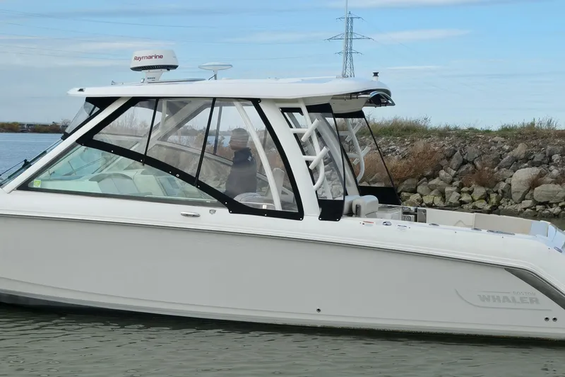 Slide: The Image of 2018 Boston Whaler 320 Vantage boat on water, side view with clear skies. - 7