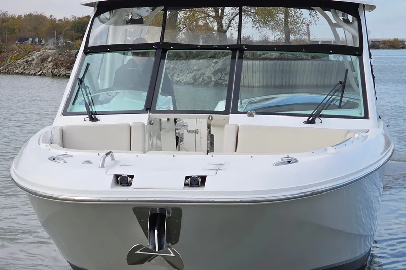 Slide: The Image of 2018 Boston Whaler 320 Vantage boat on calm water, front view. - 9