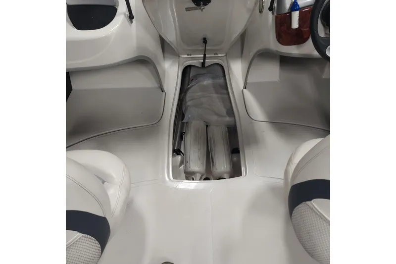 Slide: The Image of Interior view of a 2013 Nitro 290 Sport boat, showcasing seating and storage area. - 10