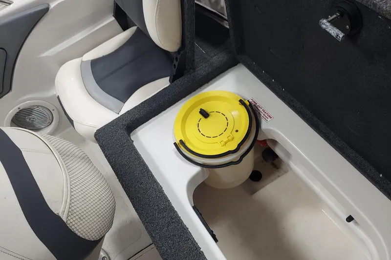 Slide: The Image of Interior of 2013 Nitro 290 Sport boat showing storage compartment and seating. - 5