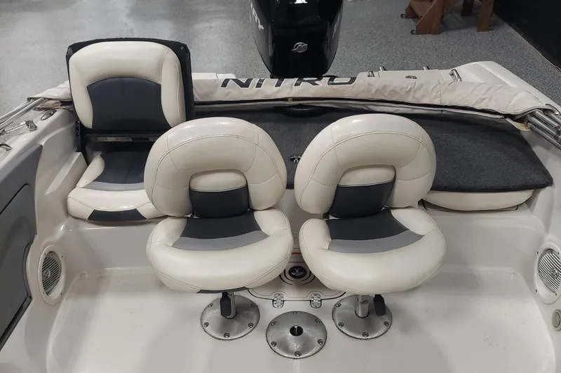Slide: The Image of 2013 Nitro 290 Sport boat interior with white and gray seating. - 6