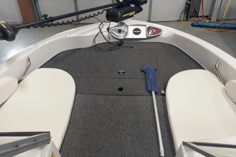 Slide: The Image of Interior of a 2013 Nitro 290 Sport boat with carpeted deck and seating. - 7