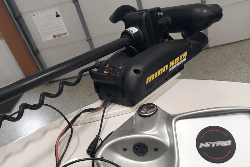 Slide: The Image of Minn Kota trolling motor on 2013 Nitro 290 Sport boat deck. - 9