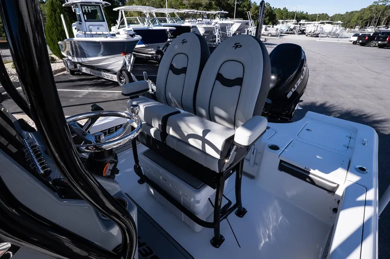 Slide: The Image of 2026 Sea Pro 230 Bay boat emblem on sleek black surface. - 10