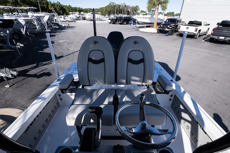 Slide: The Image of 2026 Sea Pro 230 Bay trailer wheels on gravel surface. - 12