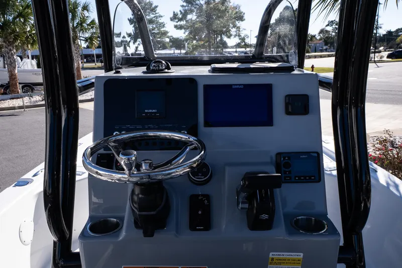 Slide: The Image of 2026 Sea Pro 230 Bay boat interior with storage drawers and cooler. - 14