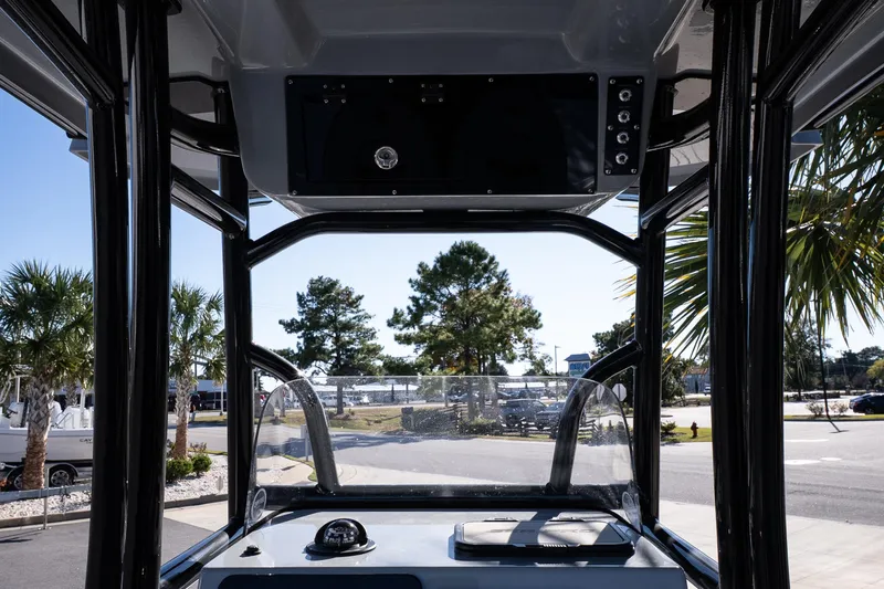 Slide: The Image of 2026 Sea Pro 230 Bay boat seats with Suzuki engine in background. - 15