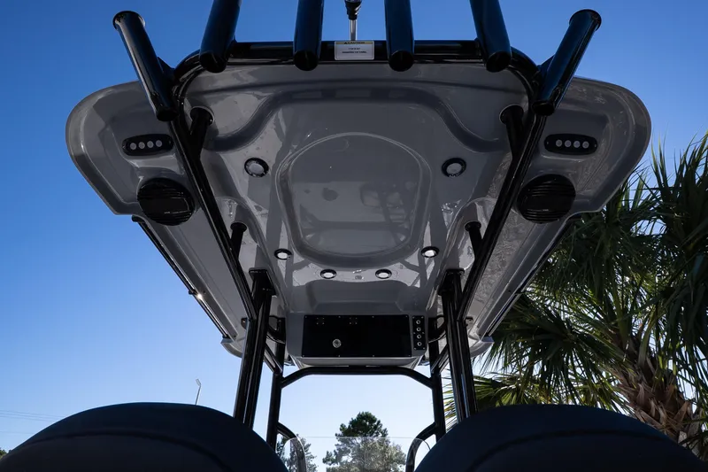 Slide: The Image of 2026 Sea Pro 230 Bay boat seat with Suzuki engine in background. - 16