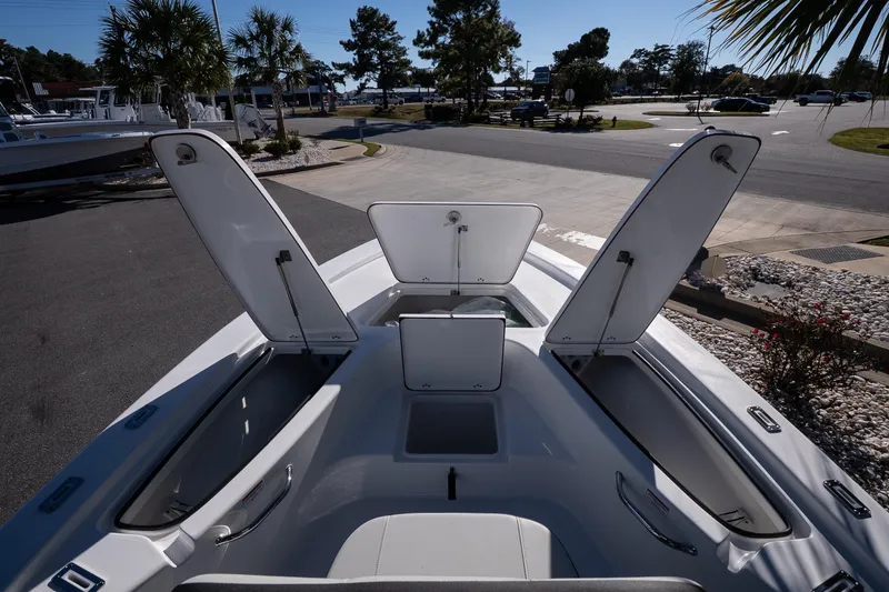 Slide: The Image of Open storage compartment on 2026 Sea Pro 230 Bay boat deck. - 18