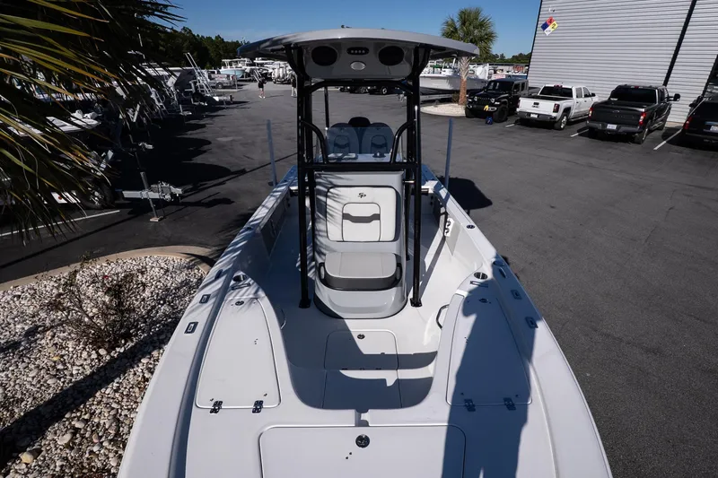 Slide: The Image of Open storage compartment on 2026 Sea Pro 230 Bay boat, parked near a road. - 20