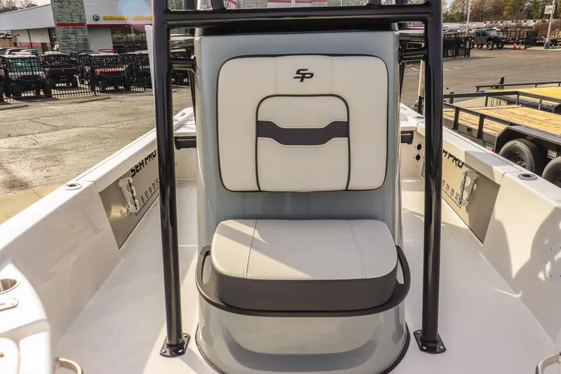Slide: The Image of 2026 Sea Pro 230 Bay boat interior with cushioned seating and sleek design. - 24