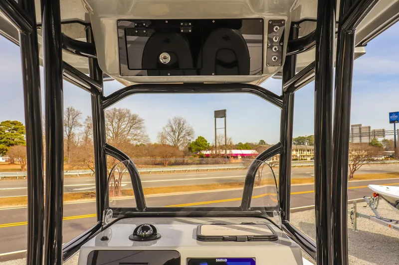 Slide: The Image of 2026 Sea Pro 230 Bay boat console with highway view in the background. - 27