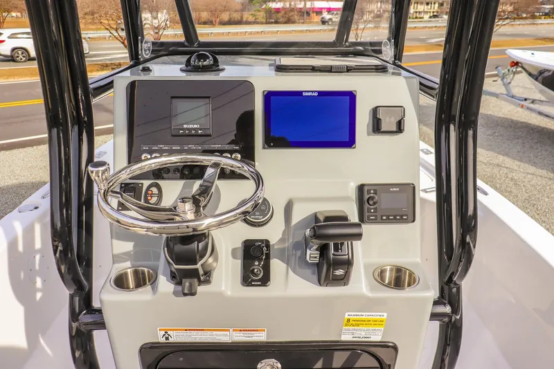 Slide: The Image of 2026 Sea Pro 230 Bay boat console with steering wheel, controls, and navigation display. - 29