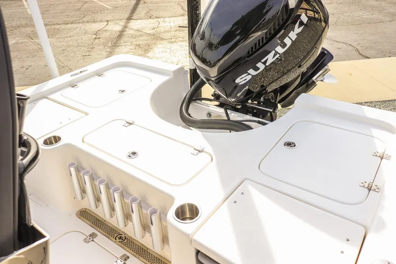 Slide: The Image of 2026 Sea Pro 230 Bay boat with Suzuki outboard motor, featuring storage compartments. - 30