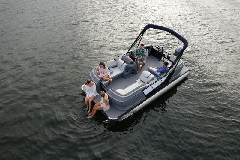 The Image of 2026 Sylvan A16 LZ pontoon boat with passengers enjoying a relaxing day on the water. - 1