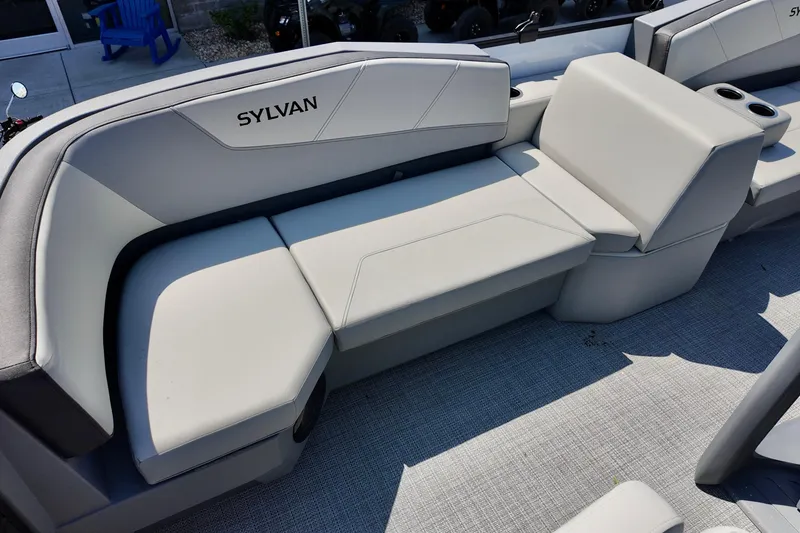 Slide: The Image of Luxurious seating on 2026 Sylvan A16 LZ boat with modern design and cup holders. - 2
