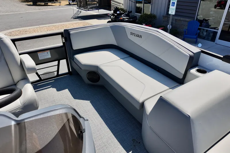 Slide: The Image of 2026 Sylvan A16 LZ boat interior with gray seating and cup holder. - 6