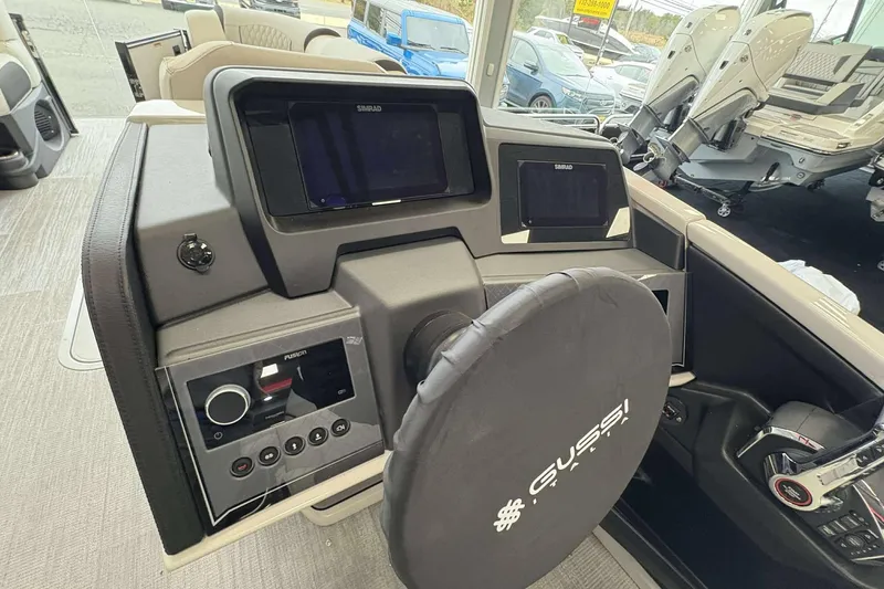 Slide: The Image of 2026 Avalon Excalibur boat dashboard with advanced controls and navigation screens. - 11
