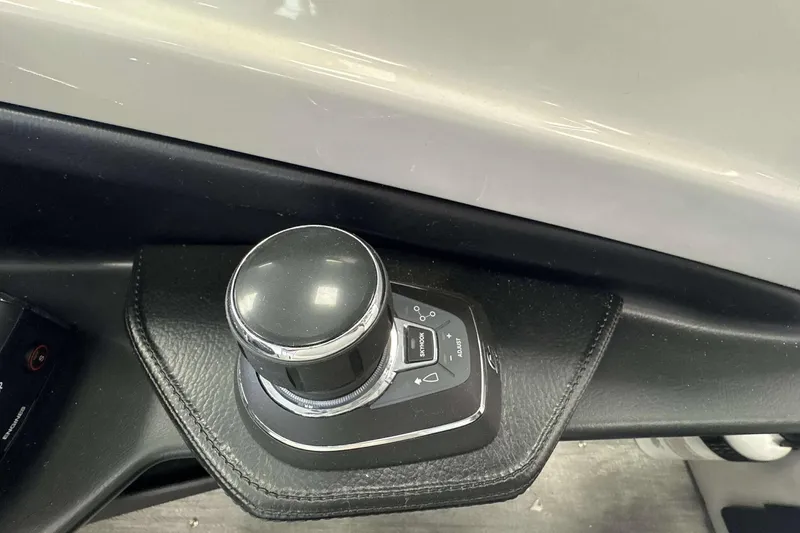 Slide: The Image of Control knob in 2026 Avalon Excalibur 25' boat, featuring sleek design and modern interface. - 12