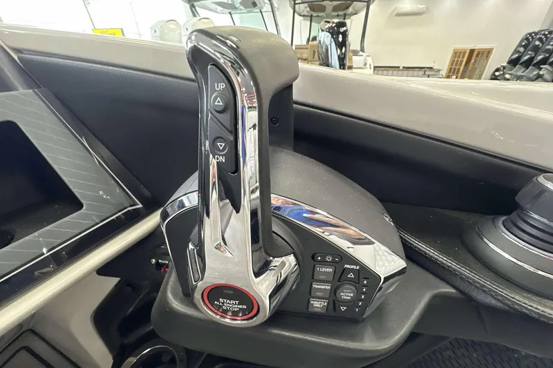 Slide: The Image of Control panel of 2026 Avalon Excalibur 25' boat with start/stop button and lever. - 13