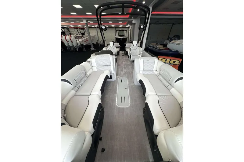 Slide: The Image of Luxurious interior of 2026 Avalon Excalibur 25' boat with plush seating and modern design. - 18