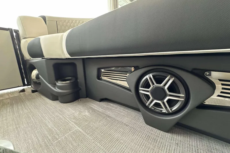 Slide: The Image of 2026 Avalon Excalibur 25' boat interior with speaker and cup holder detail. - 21