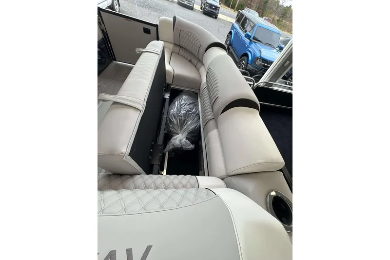 Slide: The Image of Luxurious interior of 2026 Avalon Excalibur 25' boat with plush seating. - 22
