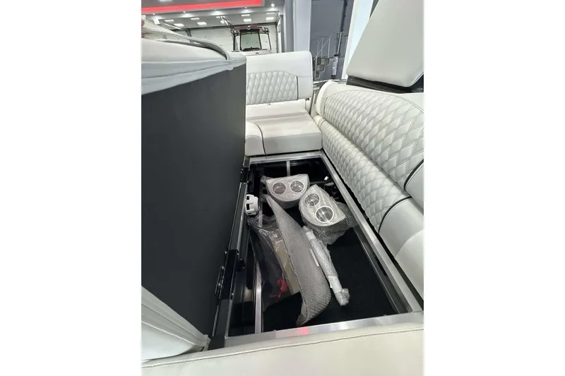 Slide: The Image of Luxurious seating and storage in 2026 Avalon Excalibur 25' boat interior. - 23