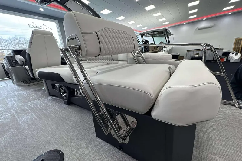 Slide: The Image of Luxurious interior of 2026 Avalon Excalibur 25' boat with plush seating and modern design. - 26