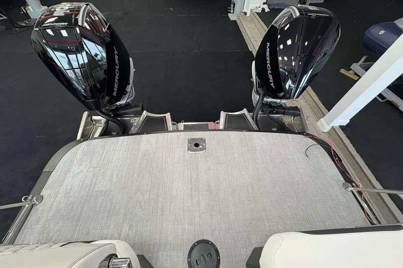 Slide: The Image of 2026 Avalon Excalibur 25' boat with dual Mercury outboard engines, rear deck view. - 6