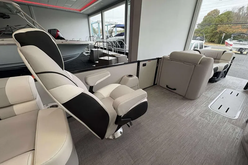 Slide: The Image of Luxurious interior of 2026 Avalon Excalibur 25' boat with plush seating and modern design. - 9